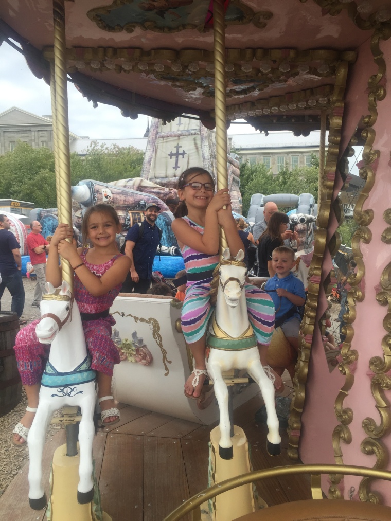 Anabelle, Mya, and Brock on a carousel during the family fun day provided by our NAMB leaders! 